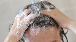 Woman in Shower Washing her Hair